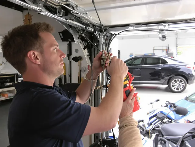 Windsor Locks Garage Door Repair safety certified technician performing cable replacement in Windsor Locks