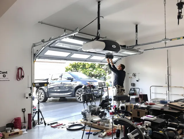 Windsor Locks Garage Door Repair specialist installing smart garage door opener system in Windsor Locks home
