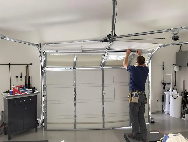 Windsor Locks Garage Door Repair specialist performing precise section replacement on Windsor Locks garage door